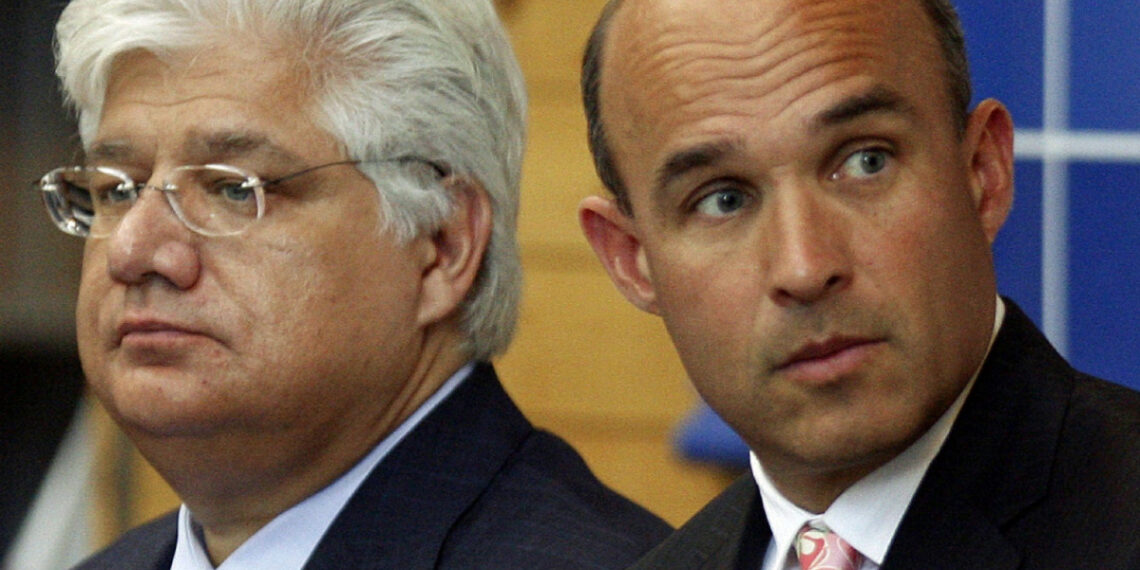 Research in Motion (RIM) co-CEO Jim Balsillie (R) and President and co-Ceo Mike Lazaridis listen during the annual general meeting of shareholders in Waterloo, Ontario, in this July 14, 2009 file photograph. Research In Motion is close to a decision on stripping its co-chief executives of their other shared role as chairman of the board, a newspaper said on January 3, 2012, a change that could meet a key demand from angry and disillusioned investors. REUTERS/ Mike Cassese/Files   (CANADA - Tags: BUSINESS TELECOMS)