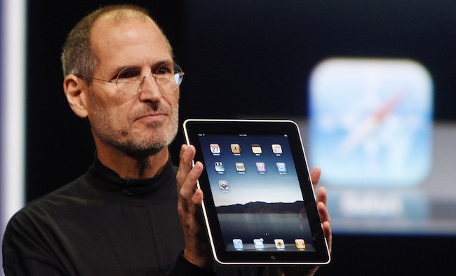Apple CEO Steve Jobs shows off the new iPad during an event in San Francisco, Wednesday, Jan. 27, 2010. (AP Photo/San Francisco Chronicle, Paul Chinn) MANDATORY CREDIT