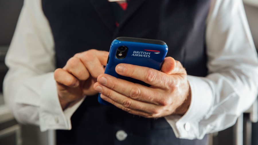 LONDON, UK: 
Cabin Crew using an iPhone XR on board a flight on 05 August 2019
(Picture by Nick Morrish/British Airways)